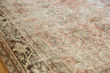 Distressed Mahal carpet texture, showing visible knot heads in dusty rose, ivory, and charcoal.