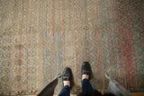 Distressed Oushak rug, allover trellis pattern with poly-chromatic red and blue streaks, showing even wear.