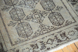 Distressed geometric guls, intricate border, and faint foundation on vintage Oushak rug runner.