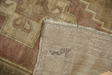 Hand knotted reverse foundation of vintage Oushak rug, with fringe and dusty plum pattern.