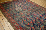 Malayer runner, allover boteh design in navy and red, showing aged low pile texture.