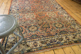 Allover floral multi-medallion pattern of the vintage Malayer carpet, with madder red and navy.