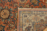 Vintage Malayer's rust multi-medallion pile, fringe, and distinct patterned border on its woven back.