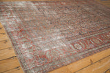 Worn wine red and silver Herati motif on a distressed Persian Mahal rug.