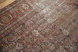 Distressed vintage Mahal rug texture, revealing Herati motif with exposed foundation.