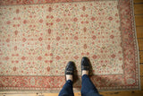 Distressed Kayseri rug with bursting floral blossoms in antique ivory and cochineal red.