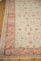 Intricate curvilinear floral border and field of a vintage distressed Kayseri rug corner.