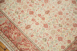 Distressed vintage Kayseri rug, intricate floral field with visible wear and cochineal red border.