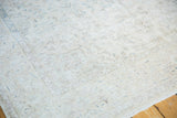 Distressed ivory Sivas carpet with subtle floral design and faded pale blue tones.