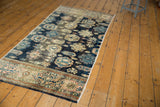 Fragmented antique Farahan Sarouk runner with allover floral cross sections and navy field.