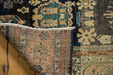 Hand-knotted foundation with dusty blush, fringe, secure side, and navy floral palmette pile.