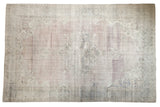 Vintage distressed Oushak carpet with an abrashed field, roundel medallion, mauve and faded teal colors.