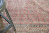Distressed vintage Sivas rug, showing blush rose boteh pattern with mostly even wear.