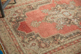 Vintage Oushak rug's distressed pile with rich cinnabar red and antique ivory.