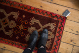 Vintage Turkish Oushak rug with thick pile, wine red field, and silver crab motif.
