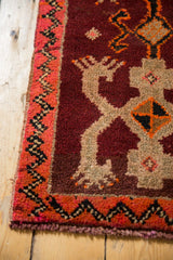 Thick pile vintage Oushak rug corner with zigzag border and beige crab motif.