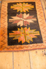 Vintage Oushak rug mat corner, dark brown field, tangerine zig zag border, thick pile.