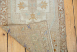 Hand-knotted Oushak rug runner with distressed pile, showing its woven reverse.