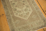 Vintage Oushak Rug Mat, diminutive floral medallion, vine border, antique ivory, beige, faded green, low pile.