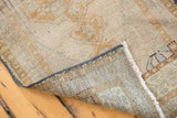 Detail of a vintage distressed Oushak rug, showing even pile wear and sturdy woven foundation.