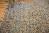 Vintage Tabriz carpet corner showing classic Samovar border and Herati motif in subtle green blue, beige.