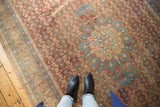 Distressed vintage Bijar carpet, brick red Herati field, roundel medallion, low pile, shown with feet.