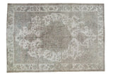 Distressed Sivas Carpet featuring a faded roundel medallion in muted gray and ivory, 6'7