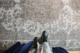 Textured vintage Distressed Sivas carpet pile in ivory, gray, and subtle teal tones.