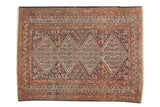 Vintage Malayer rug, sharply serrated diamond medallions, boteh motifs, inky blue, faded brick red, sand.