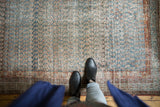 Heavily abrashed blue and sea foam mir boteh on a distressed Serbend rug with visible wear.