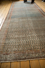 Textured close-up of distressed vintage Serbend rug runner, with abrashed mir boteh design.