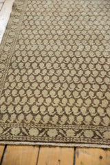 Distressed Mir boteh design in beige and chocolate brown on an antique Malayer runner.