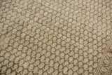 Distressed Malayer rug close-up showing Mir boteh pattern, worn beige, chocolate brown, narrow border.