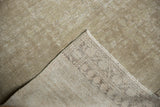 Antique distressed Malayer rug corner displaying worn beige pile, abrashes, and reverse Mir boteh foundation.