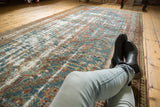 Distressed Malayer rug runner with denim blue, dusty red, and ivory worn tree-of-life pattern.
