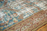 Distressed vintage Malayer rug with low pile denim blue field and ornate madder red borders.