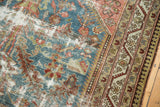 Vintage Malayer runner showing its distressed denim blue field, sand wear, and detailed pistachio border.