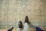 Distressed Herati pattern of vintage Tabriz carpet in soft ivory, sand, and teal tones.