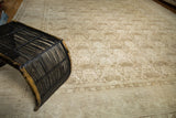 Distressed vintage Tabriz carpet, showing its muted shadow laurel motif and subtle border.