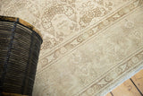 Faded shadow laurel design motif and even wear on a Vintage Distressed Tabriz rug.