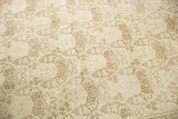 Distressed vintage Tabriz carpet with shadow laurel motif in ivory and dusty brown.