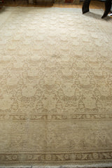 Detail of vintage Tabriz rug border with shadow laurel motif, showing distressed pile and fringe.
