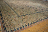 Distressed Mahal carpet showing worn pile, visible foundation, and decorative cobalt blue border.