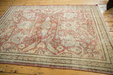 Distressed raspberry red field with ivory palmettes meeting the detailed, sand-toned Mahal border.