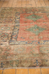 Abrash color variation and low textured pile on vintage distressed Oushak rug edge.