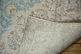 Hand-knotted foundation weave visible beneath the distressed vintage Sivas carpet pile.