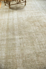 Distressed vintage Kashan rug with subtle pattern, textured pile, and mostly even wear.