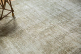 Textured surface of the distressed Kashan carpet, showing subtle design and even wear.