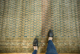 Distressed vintage Malayer rug with faded indigo and sand Mir boteh motif and textural abrashes.