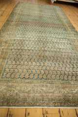 Vintage Malayer runner showing distressed Mir boteh pattern, with softened indigo, sand, and apricot hues.